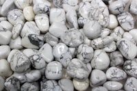 a pile of white and black marble pebbles