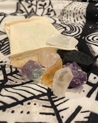 a bag of crystals and stones on a black and white background